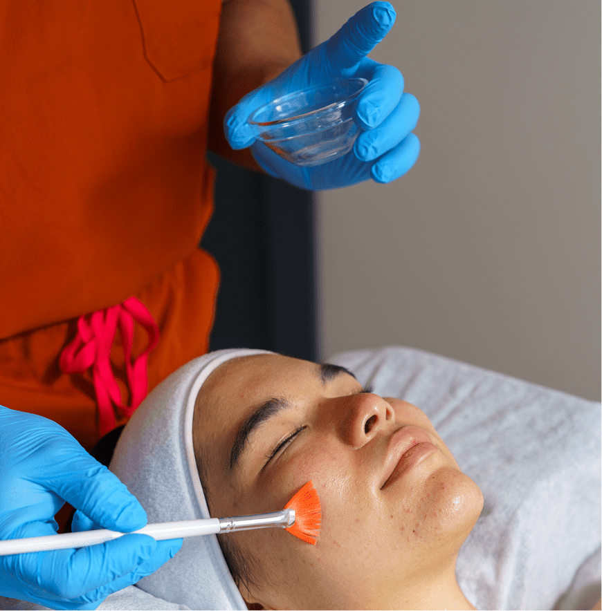 Spa facial with orange mask application