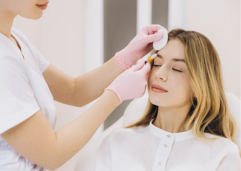 Professional administering beauty treatment to patient